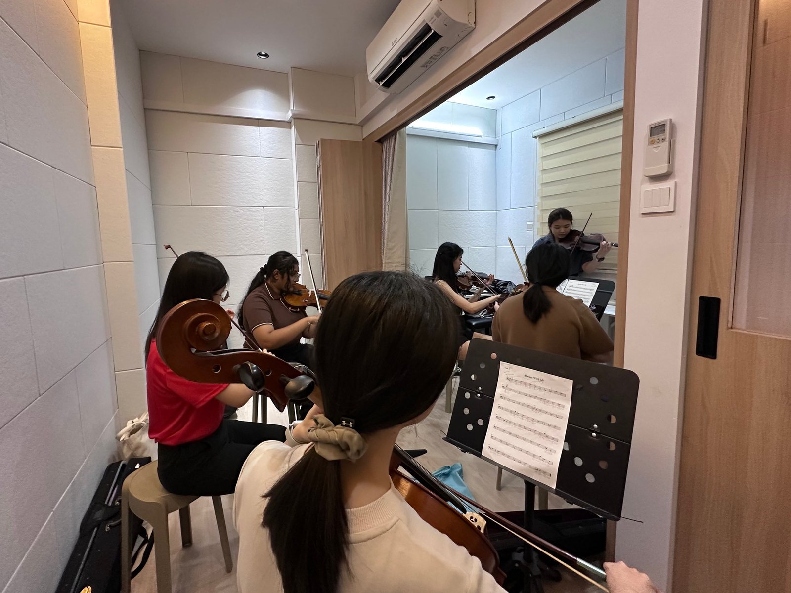 Adult students playing together in a group class at Bowed Strings