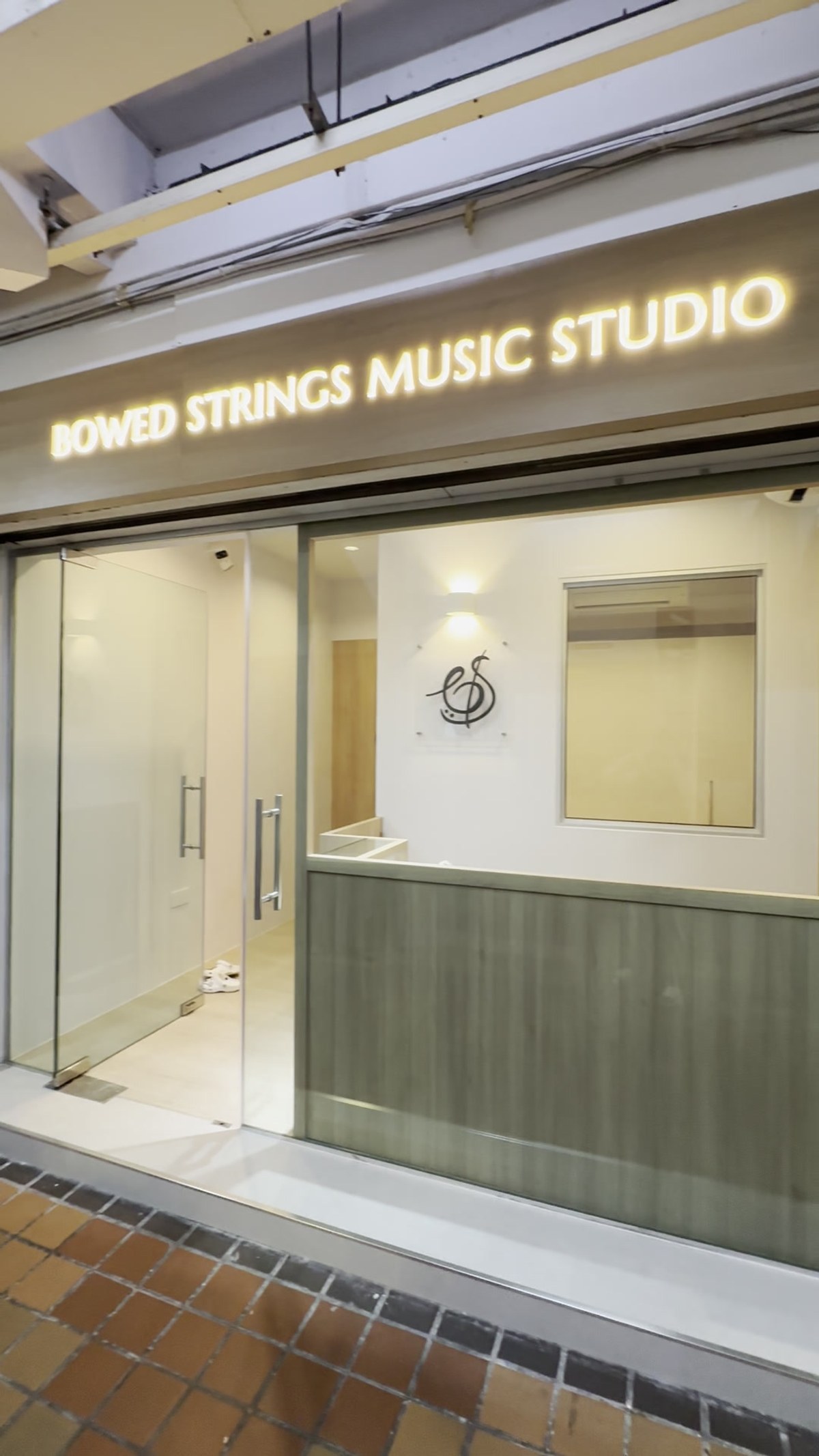 The Bowed Strings logo on the studio wall